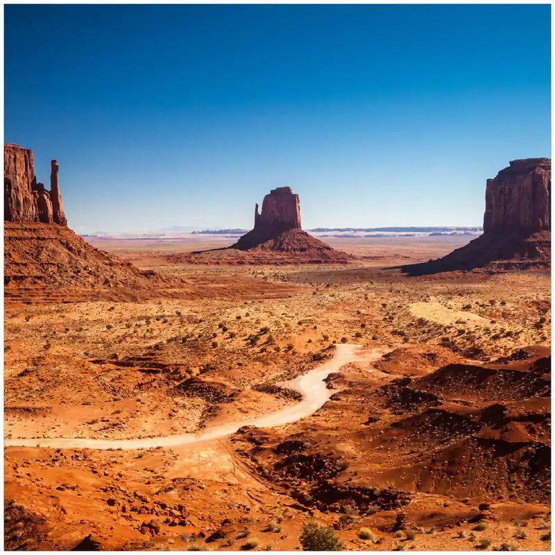 Gratis Versand Glasbild Monument Valley unter blauem Himmel 50 x 50 cm
